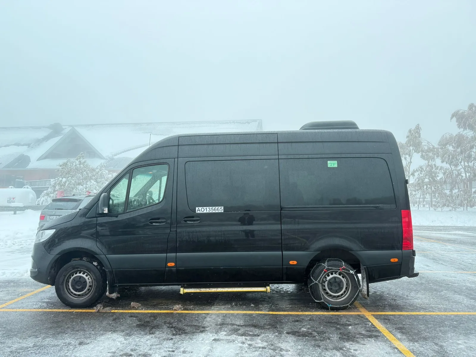 Mount Buller private chauffeur tour with luxury people mover in snow